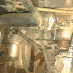 Снятие термостата с корпуса двигателя на седане Лада Калина